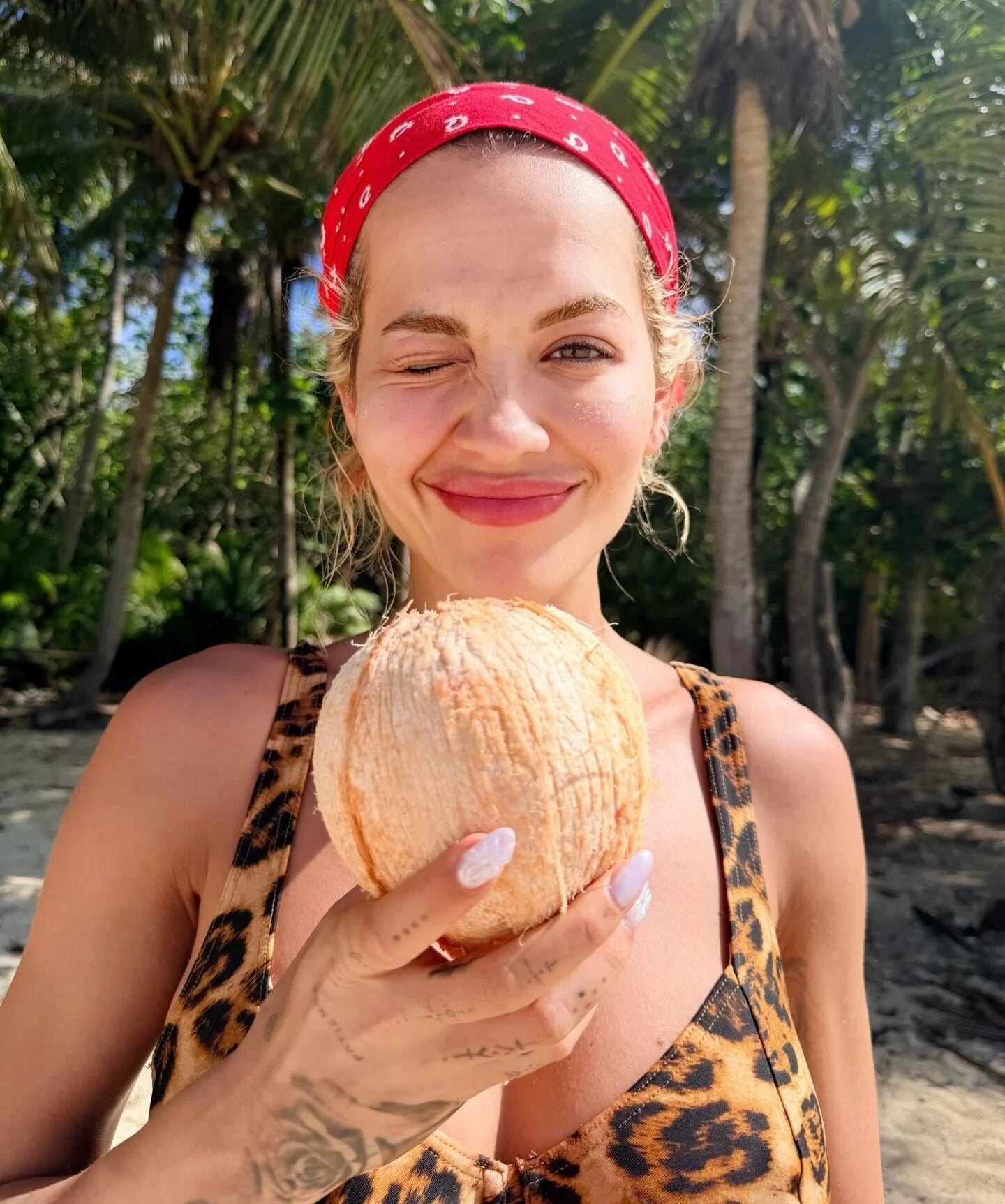 Rita Ora in leopard print bikini top at tropical beach, January 2026