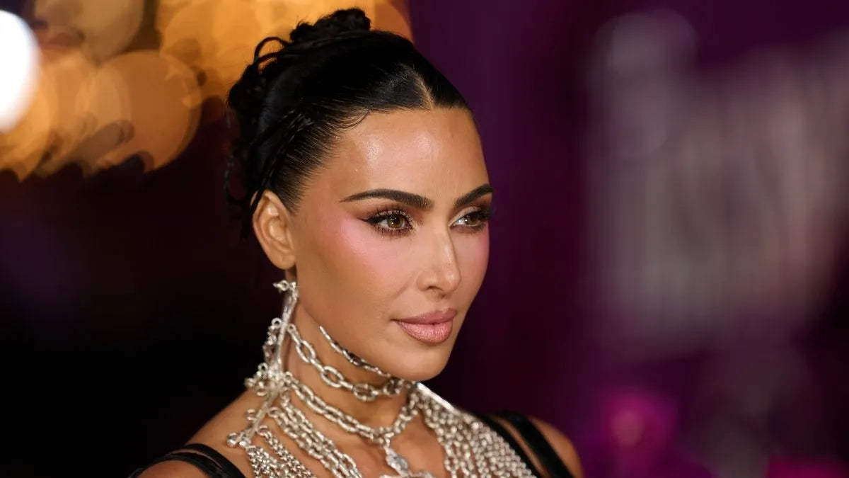 Kim Kardashian in a black SKIMS bikini for the spring 2026 campaign