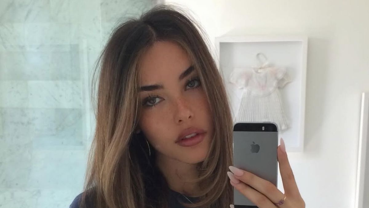 Madison Beer in polka dot bikini bottoms and navy tee mirror selfie March 2026