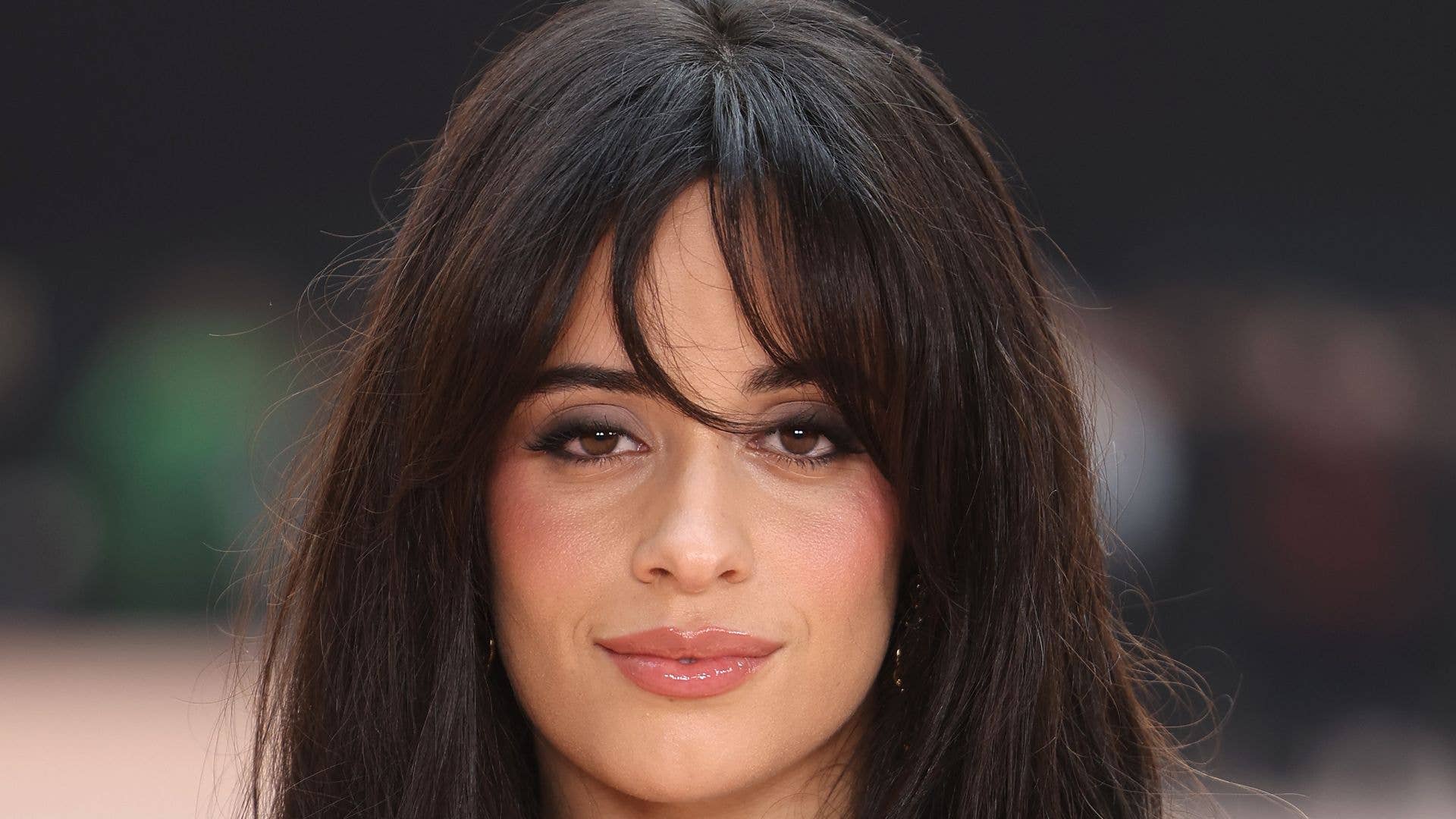 Camila Cabello in red string bikini on tropical vacation February 2026
