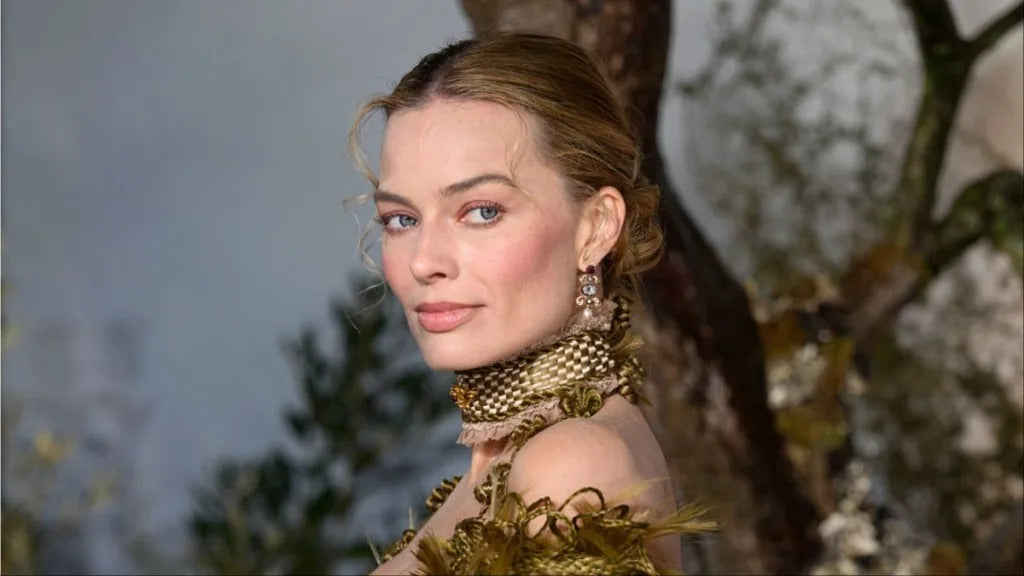 Margot Robbie in black Chanel monokini for Rouge Allure Velvet campaign spring 2026