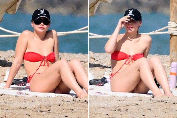 "Outer Banks Star Madelyn Cline Stuns in Cheeky Red Thong Bikini and Tiny Playboy Hat on Spanish Beach During Filming Break!"