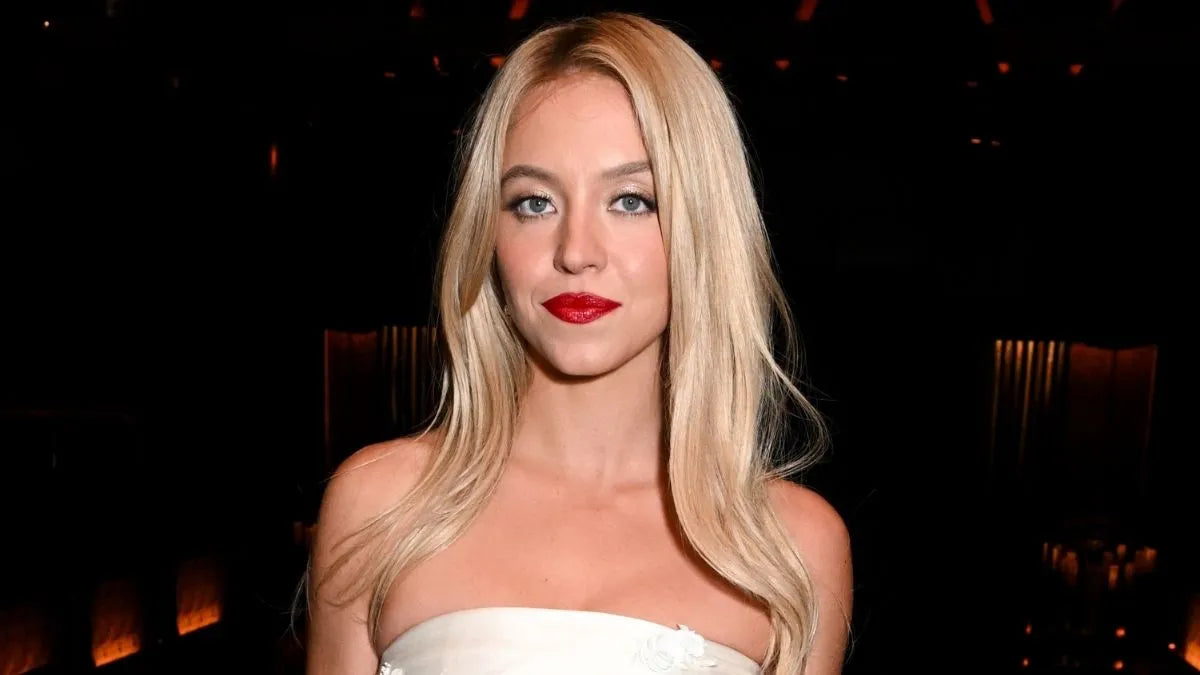 Sydney Sweeney in SYRN campaign wearing white corset and lacy bikini bottom